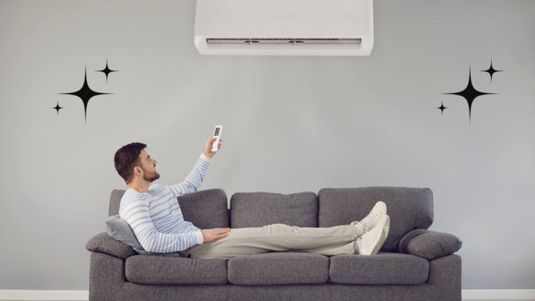 A young boy sitting in a bright, cozy room, reaching to switch on the air conditioner for a refreshing breeze.